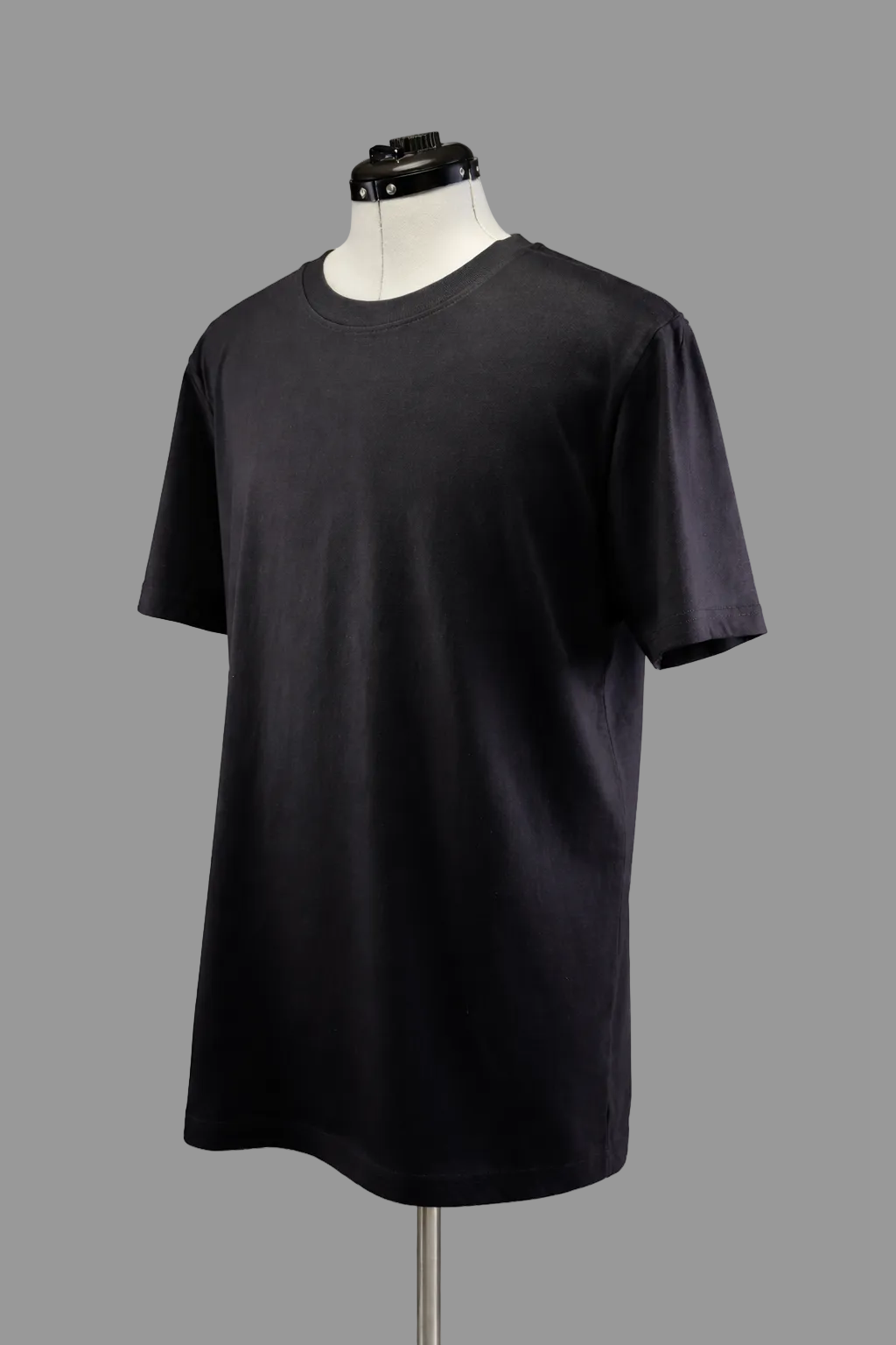 Angled front view showing drape and structure of black 215 gsm organic cotton T-shirt, ARC Exhibit 01 Vector